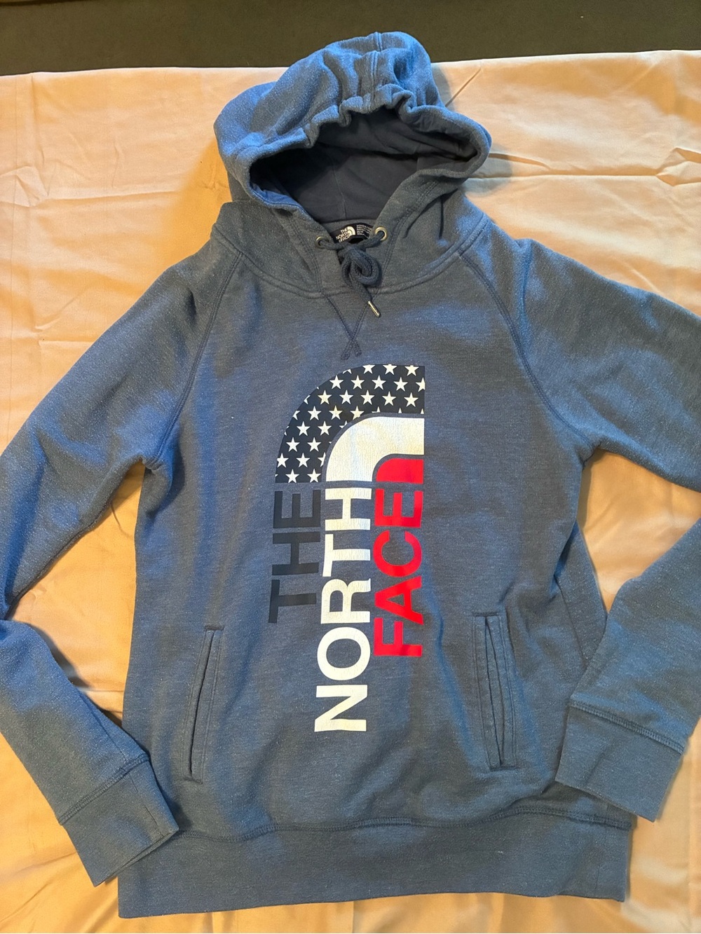 The North Face Women’s Blue Pullover Hoodie with Flag Graphic